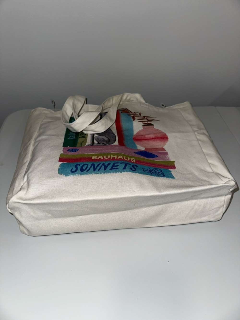 kate spade Ivory Multi Bookshelf Dog Figurine Canvas Tote Bag - Picture 8 of 9